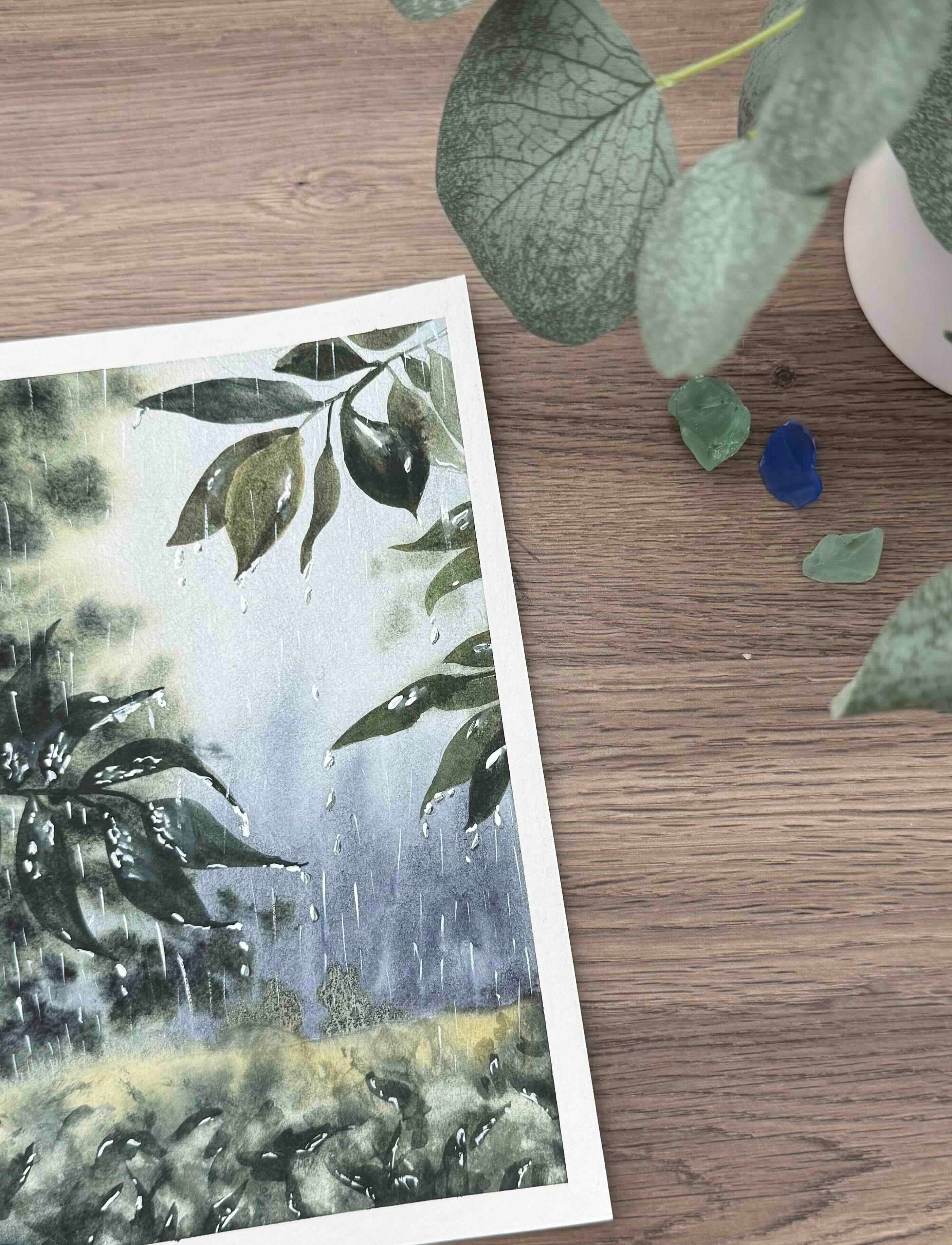 Rainy watercolor painting on an artist’s desk